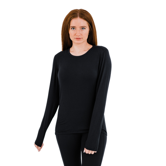 Women's crewneck base layer in black, made from a soft, moisture-wicking fabric for warmth during cold weather activities.